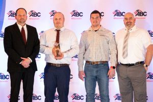 Faith Technologies project team members accepting the ABC of Wisconsin Projects of Distinction award. Left to right: Aaron Bizub, group leader; Max Szalewski, licensed electrician 1; Brandon Roberts, ICIAN 1; Jason Eiting, associate project manager.